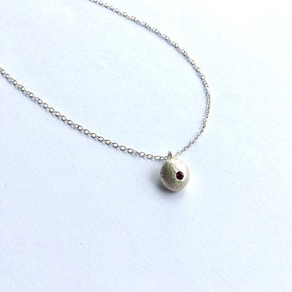 flush set rhodolite garnet in recycled silver ball pendant on a choice of chains - www.wyckoffsmith.com