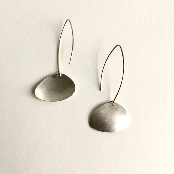 View of back and front of cherrystone clam earrings in sterling silver by www.wyckoffsmith.com
