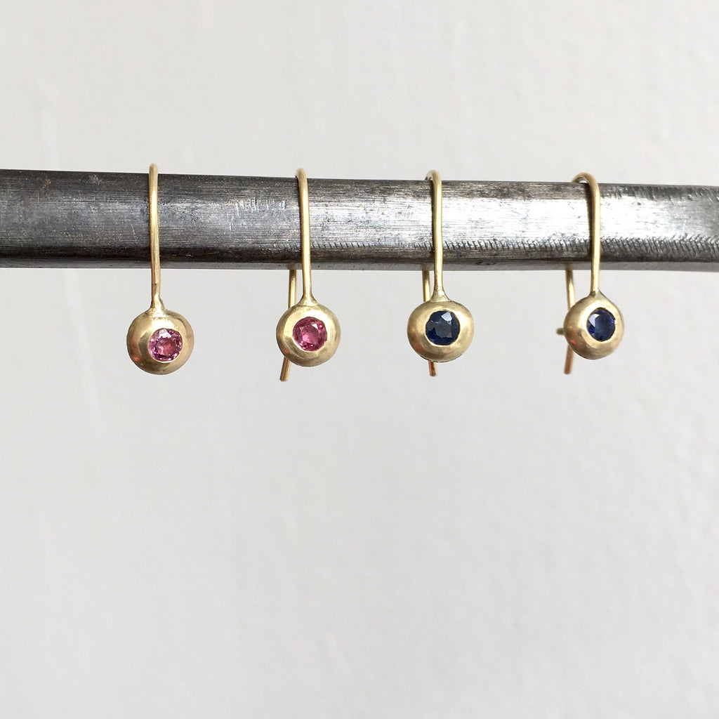 Ruby and sapphire dangle drop recycled 18 ct gold earrings on a steel bar - www.wyckoffsmith.com - gold hook earrings set with stones