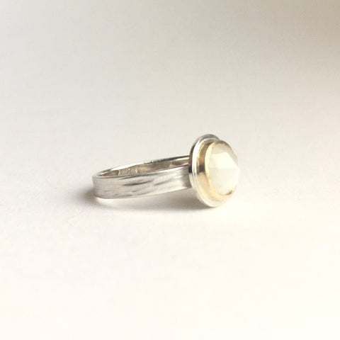 Side view of white moonstone set in 18 ct gold on silver textured band by Michele Wyckoff Smith on www.wyckoffsmith.com