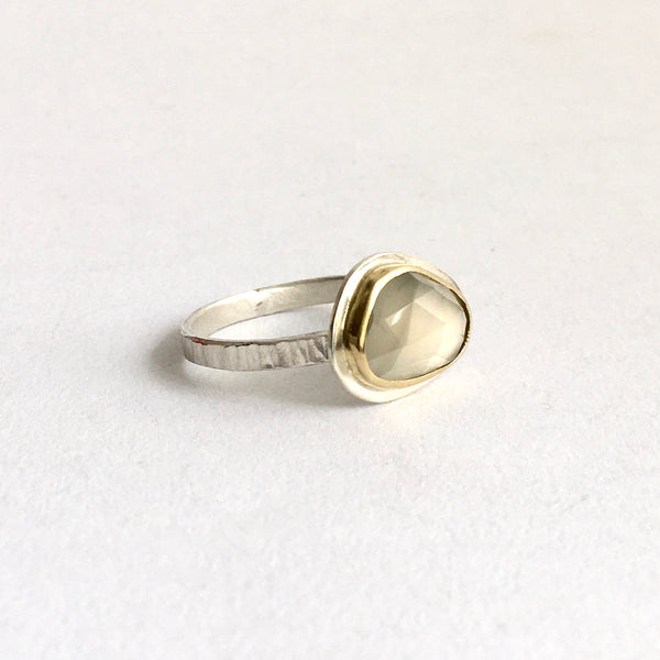 Side view of grey moonstone set in 18 ct gold with hammered ring shank - www.wyckoffsmith.com