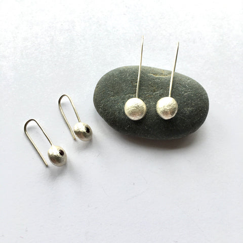 Recycled ball earrings, two types by dark stone. www.wyckoffsmith.com
