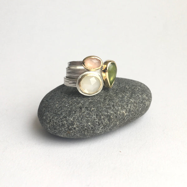 Stack of three gemstone rings on www.wyckoffsmith.com top to bottom: peach moonstone, green idiocrase and white moonstone