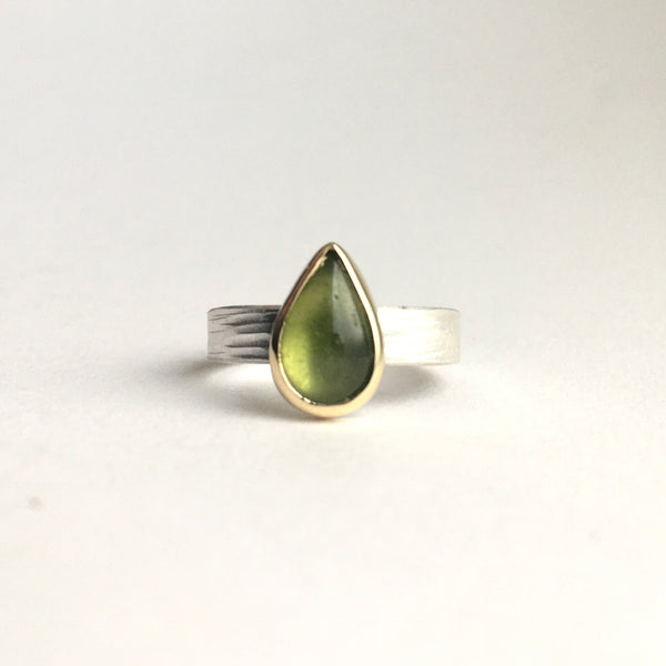Front view of a green pear shaped indiocrase stacking ring. Silver and gold ring on www.wyckoffsmith.com